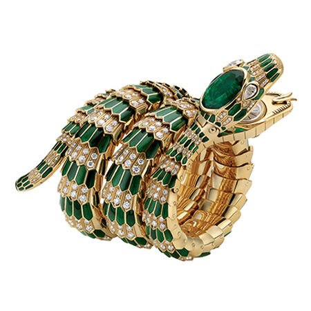 Serpenti bracelet-watch in gold with green enamel, emerald and diamonds.